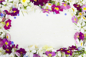 Spring flowers on vintage background.

Beautiful, colored, spring flowers on a white, vintage, wooden background.