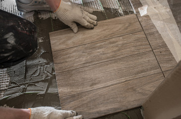 Laying tile stylized tree on the insulated floor.