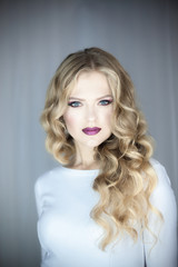 Portrait of beautiful young blond woman with clean face .Close up beauty portrait of young model with clean fresh skin and professional makeup.