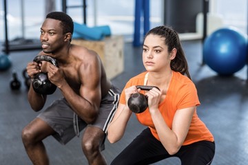 Naklejka premium Athletic man and woman working out
