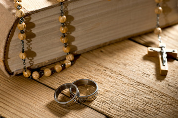 weddings rings, bible and prayer beads