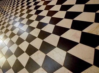 Closeup of floor tiles arranged in 3D cubes checkerboard pattern