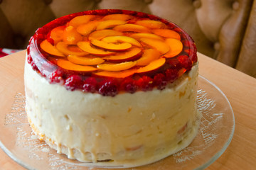 Cake with jelly from peaches, apricots and raspberry