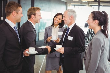 Businesspeople having a discussion during break time