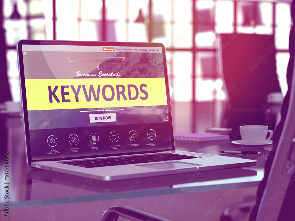 Poster modern workplace with laptop showing landing page with keywords concept. toned image with selective 