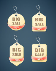 set of big sale paper labels with red ribbon