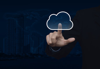 Businessman click on cloud icon with copy space over map and cit © grapestock