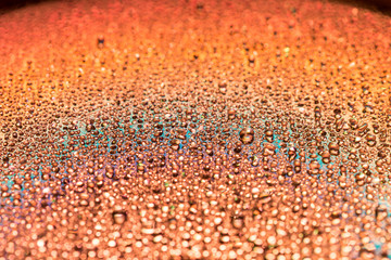 water drip on Orange Compact disc macro shot