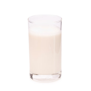 glass of warm milk on white background