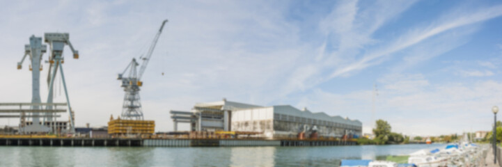 Shipyard crane, blurred.