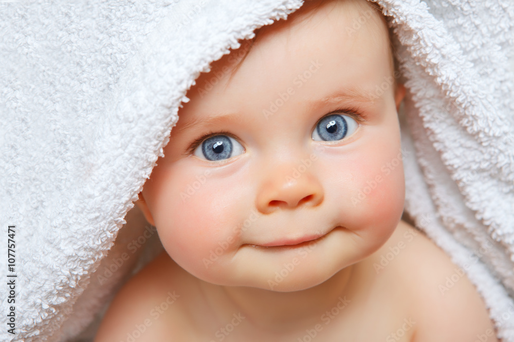 Wall mural baby under a towel