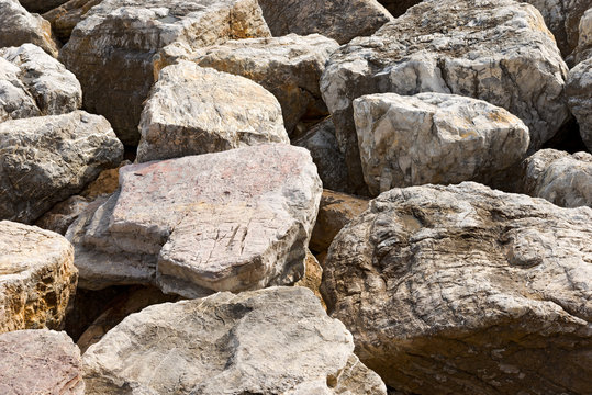 Detail of an Italian breakwater with large boulders. Liguria, Italy