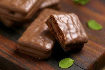 Chocolate wafer cookies on brown wood
