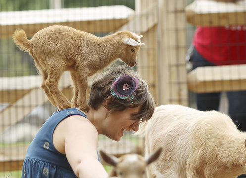 Young Woman and Baby Goat