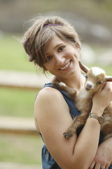 Youth Woman and Baby Goat