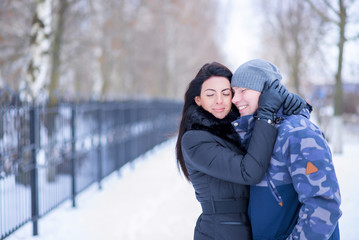 Beautiful adult couple love, park in winter