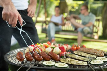 Grilling sausages and vegetables