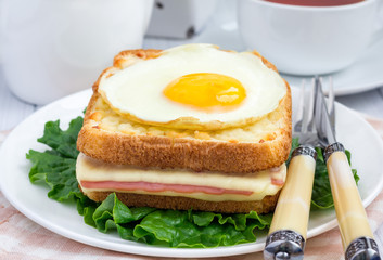French toasted sandwich Croque madame with ham and cheese