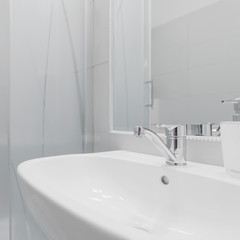 Fototapeta premium Porcelain washbasin in white toilet