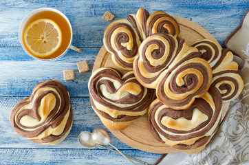Sweet chocolate buns Heart and Butterflies on the table