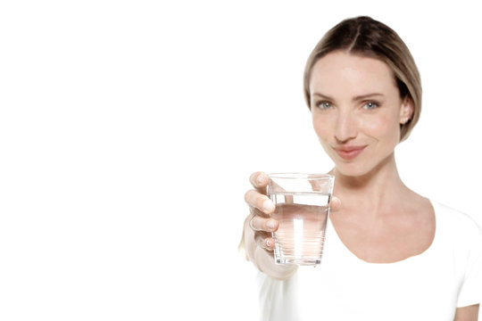 Young Caucasian woman offering a glass of water