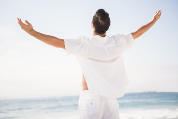 Man relaxing on the beach on a sunny day