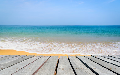 Fototapeta na wymiar Beautiful beach and tropical sea with wooden walkway