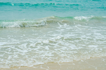 Wave of the sea on the sand beach