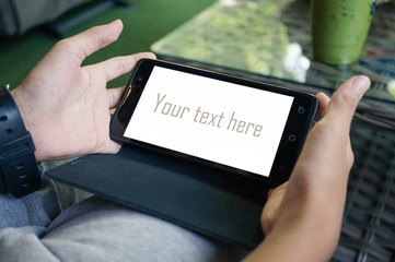 Boy child holding smartphone with clipping path