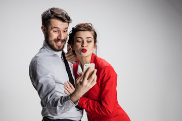Two colleagues friends taking selfie with telephone camera 
