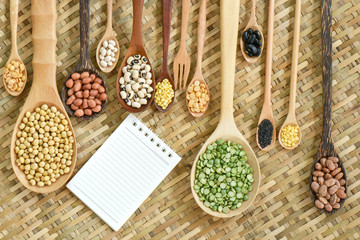 Top view of various leguminous with a wooden cookware, Flat lay