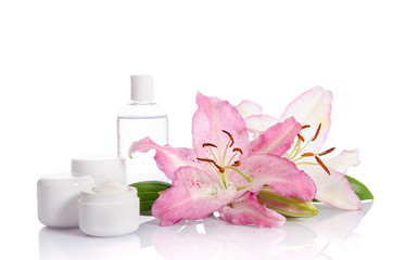 Obraz na płótnie Canvas cosmetic set for skin care on a white background with flowers li