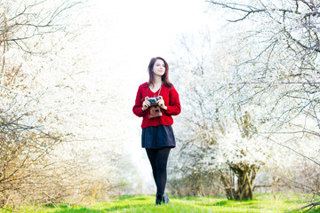 portrait of young woman with camera