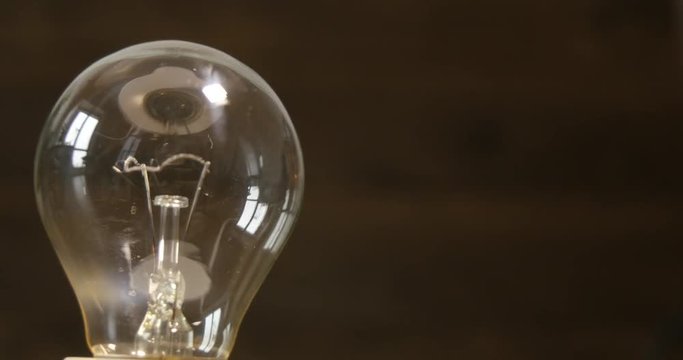 4k Slowly 360 degree rotating incandescent lamp, looped video