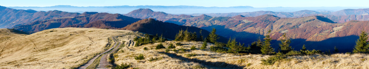 Rural road in autumn mountain.