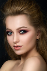 Fototapeta premium Close up portrait of young beautiful woman with fashion makeup