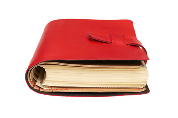 red leather notebook isolated on white