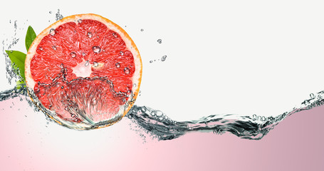Grapefruit on a background of splashing water.