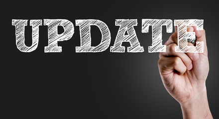 Hand writing the text: Update