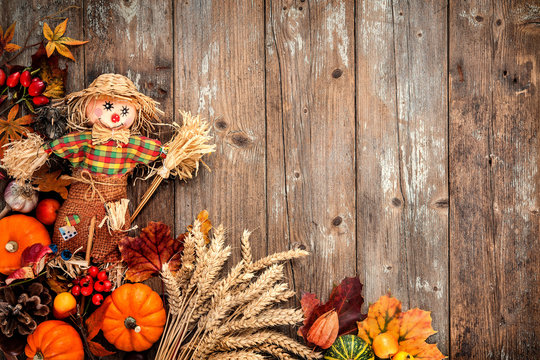 Colorful autumn background with a scarecrow decoration for Halloween and Thanksgiving