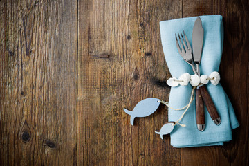 Fototapeta na wymiar Fish cutlery tied with empty fish shaped tag