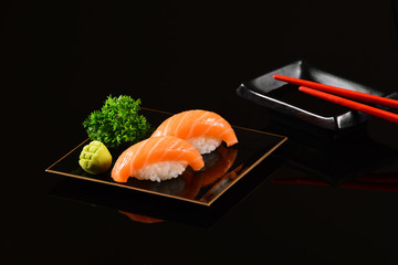 Salmon Nigiri isolated on black background