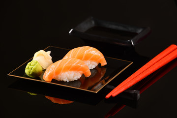 Salmon Nigiri isolated on black background
