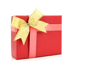 red gift box with gold ribbon on white background.
