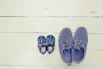 top view of father and baby shoe were put together