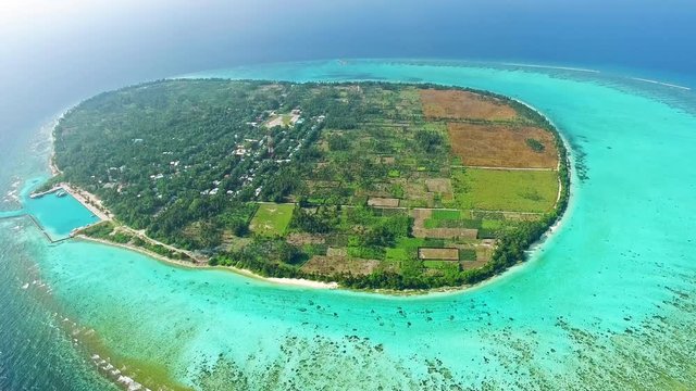 Maldivian island Thoddoo top bird's eye view. Indian Ocean.