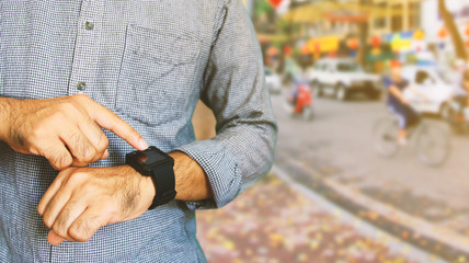 Man using smart watch.