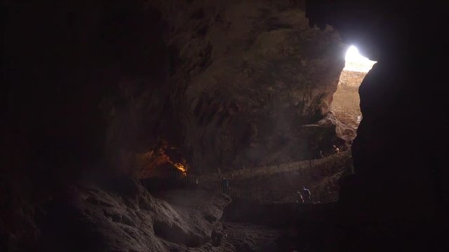 Tourists enter and exit the cave at the Natural Entrance to Carlsbad Caverns National Park in New Mexico