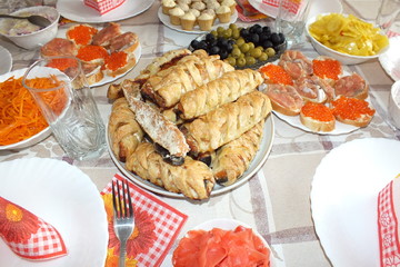 food, serving, rolls, sandwiches, treats, guests, appetizers