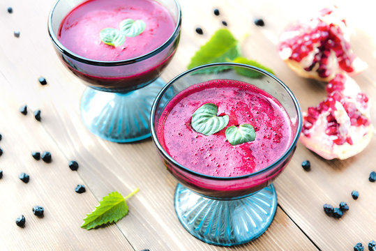Pomegranade juice in colorful blue cups